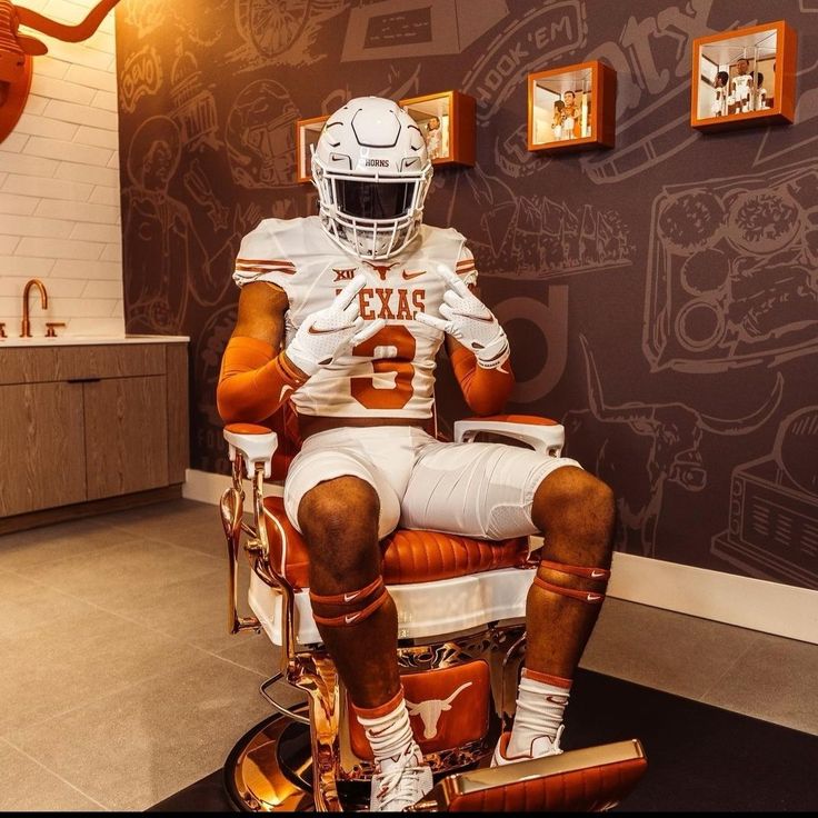 a football player sitting in a barber chair