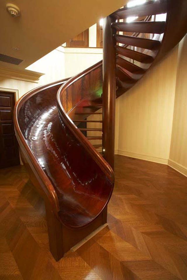 a wooden spiral staircase in a home