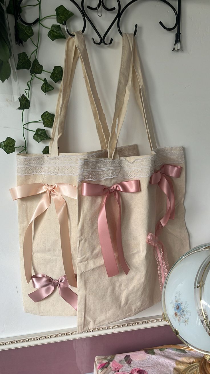 Coquette🎀Tote bags 👛dm for any questions ! 🤍 Feminine Cream Bags For Gifts, Cream Tote Bag As A Gift, Cute Beige Canvas Shopping Bag, Cream Bucket Bag As Gift, Beige Tote Shoulder Bag As Gift, Feminine Tote Shoulder Bag For Gift, Feminine Cream Bag For Shopping, Feminine Cream Bags For Shopping, Vintage Beige Canvas Shopping Bag