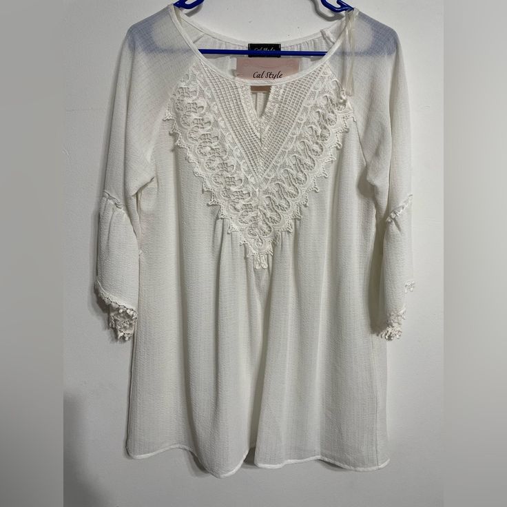 Beautiful White 3/4 Sleeves Woman Blouse , The V Neck Is In Lace Make The Piece Gorgeous . White Half Sleeve Blouse For Spring, White Tops With 3/4 Sleeve And Lace Trim, Feminine White Half-sleeve Blouse, Feminine White Half Sleeve Blouse, Spring Half Sleeve Tops With Lace Trim, Bohemian Blouse With 3/4 Sleeves For Daywear, White 3/4 Sleeve Blouse For Vacation, White Casual Peasant Top With 3/4 Sleeves, Casual White Peasant Top With 3/4 Sleeve