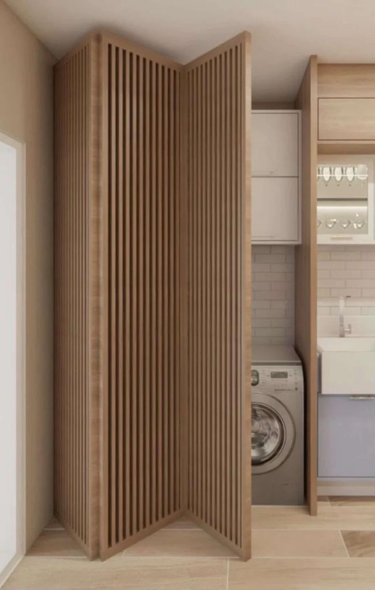 a room divider in the middle of a kitchen with washer and dryer