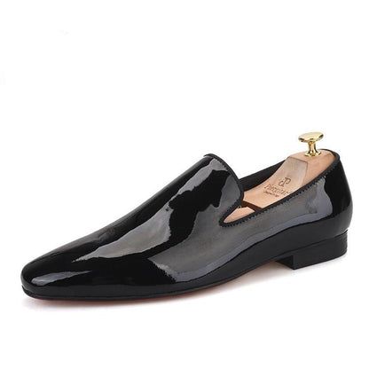 Sleek Black Slip-ons With Rubber Sole, Modern Black Tassel Loafers For Formal Occasions, Black Plain Toe Slip-on Tassel Loafers, Sleek Black Loafers With Leather Sole, Black Business Loafers With Rubber Sole, Black Slip-on Tassel Loafers For Business Casual, Black Slip-on Tassel Loafers With Plain Toe, Sleek Black Slip-ons, Black Patent Leather Loafers With Rubber Sole