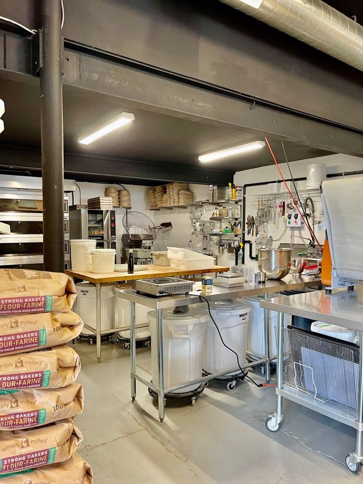 an industrial kitchen with lots of food in it