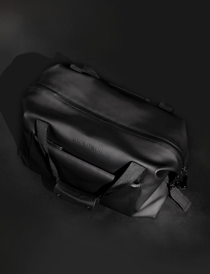 Size: Travel size carry on | L17.5" x W7.5" x H13"Capacity: 28L | work + workout clothes + trainers | 3 outfitsLength of trip: Daily commute to 3 day trip Introducing our most ambitious product yet: the Odyssey Weekender, an essential overnight bag engineered to be taken everywhere and carry everything you need for your work, workout, flights and every kind of trip. The Odyssey is built using a sturdy and substantial waterproof fabric known for its carrying strength and durability. Then, we rein Functional Black Travel Bag With Luggage Sleeve, Black Athleisure Bag For Gym, Black Waterproof Weekender Bag For Everyday Use, Everyday Waterproof Functional Duffle Bag, Everyday Functional Waterproof Travel Bag, Black Waterproof Weekender Bag For Travel, Black Waterproof Duffle Bag For Everyday Use, Casual Black Waterproof Travel Bag, Versatile Black Waterproof Travel Bag