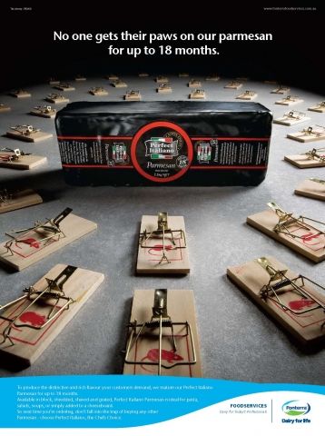 a group of mouse traps sitting on top of each other in front of a black box