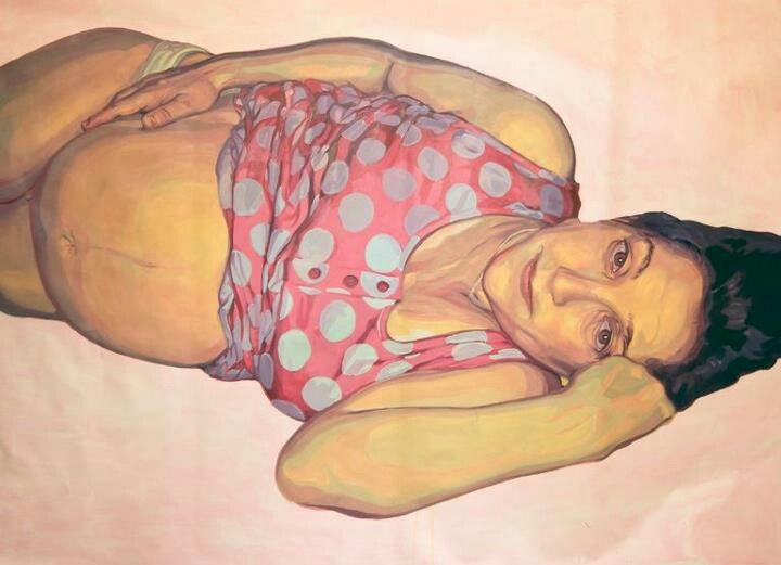 a painting of a woman in pink and white polka dot shirt laying on her stomach