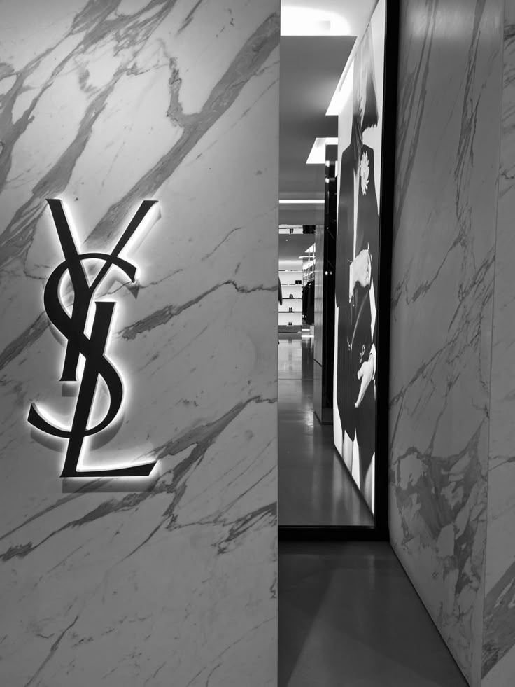 a black and white photo of a wall with the y logo on it