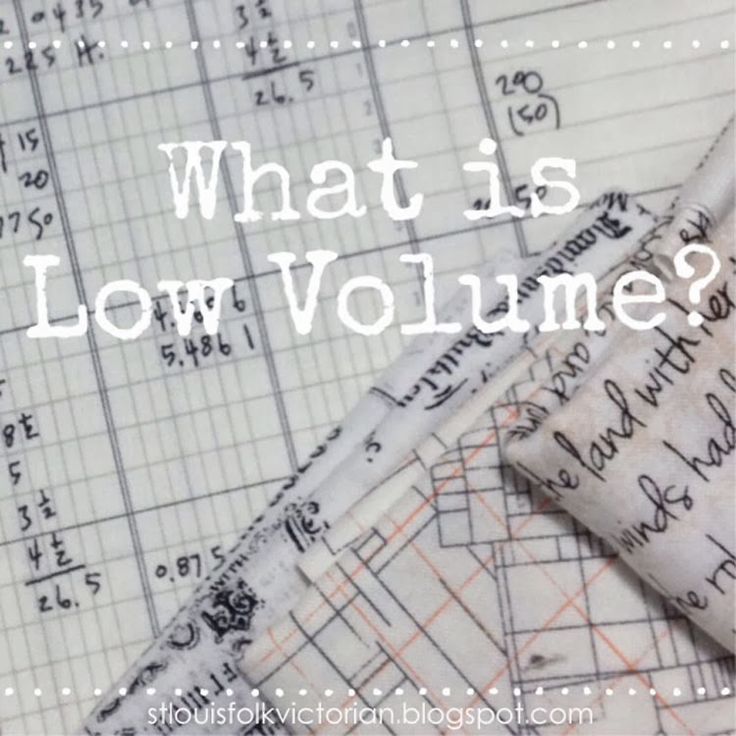 the words what is low volume? are printed on fabric and laid next to each other