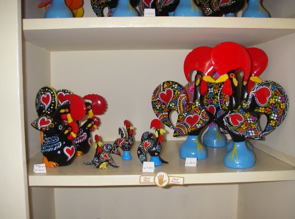 a shelf filled with lots of colorful figurines on top of it's shelves