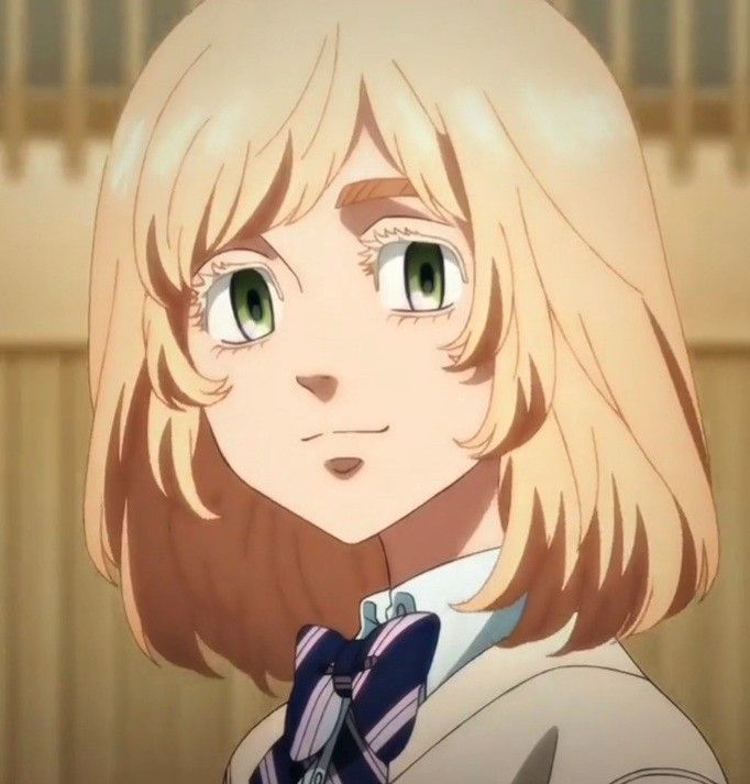 an anime character with blonde hair and green eyes