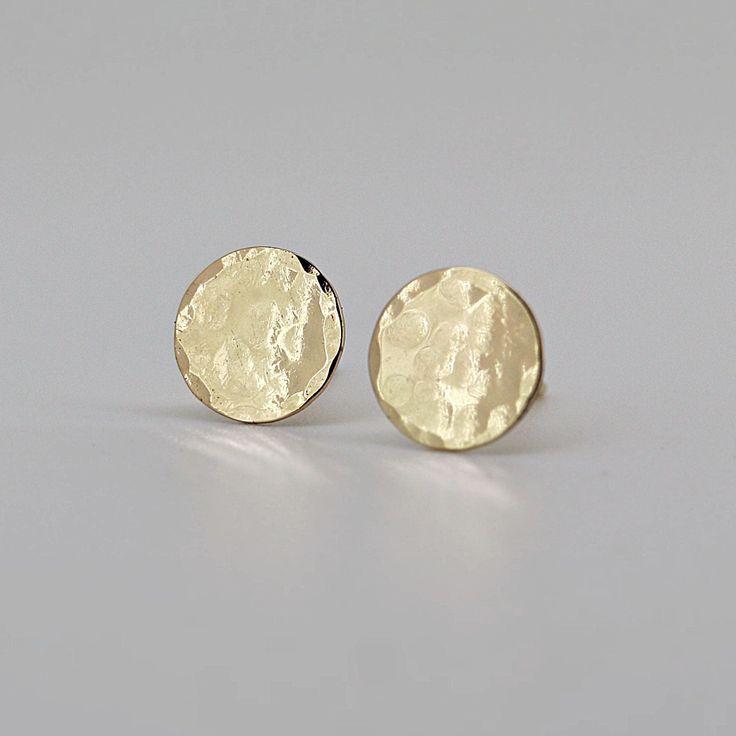 Modern, simple, 14k solid gold hammered disc stud earrings. Hand hammered gives them a little sparkle. Everyday earrings. ***14k solid gold hammered discs are 6.4mm diameter. ***14k solid gold posts and backings. This earrings were hand crafted in Melt'm Jewelry Studio in California. Thanks for visiting Melt'm Design Studio Minimalist Hammered Yellow Gold Earrings, Hammered Yellow Gold Round Disc Earrings, Hammered 14k Gold Earrings For Gift, Gold Disc Earrings, Gold Disc, Disc Earrings, Gold Stud Earrings, Hammered Gold, Jewelry Studio