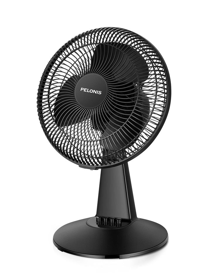 a black fan sitting on top of a table