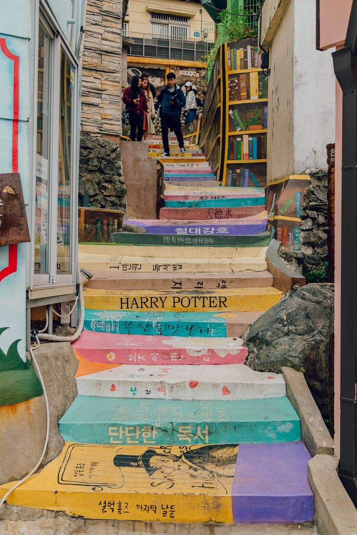 there are many stairs painted with different colors