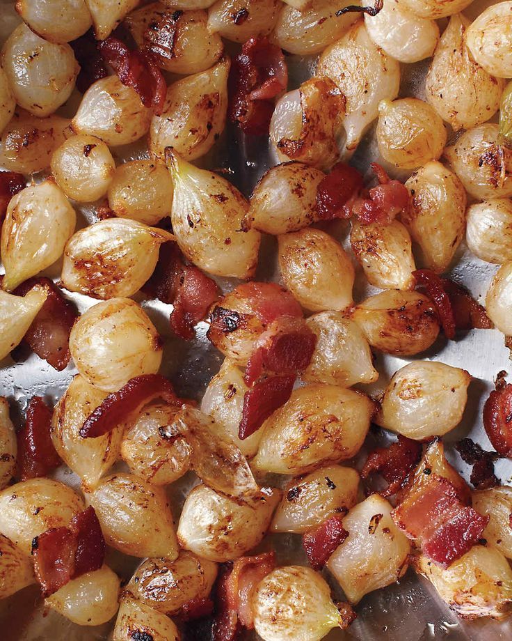 bacon and potatoes are being cooked in a pan