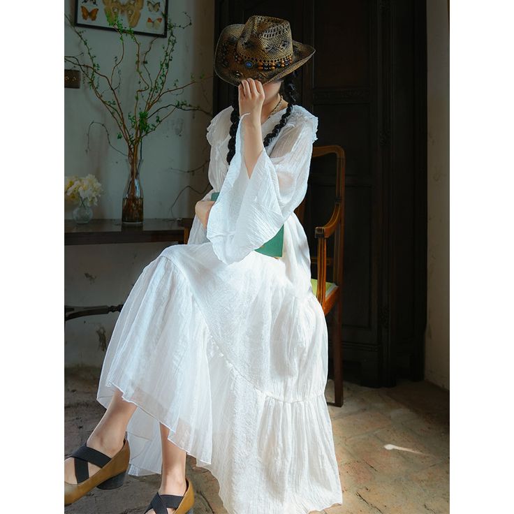 A dress with a noble and elegant atmosphere, like a beautifully flapping swan. It is characterized by its light and fluffy fabric. The chest is decorated with plenty of ruffles, and the sleeves are sheer and flare out toward the cuffs. Wear it with dazzling sparkle and shine like a leading role. 
 
 ＜Size＞ 
 
 S size
 
 Length: 122cm 
 
 Bust: 114cm 
 
 Sleeve length: 67cm 
 
 
 M size
 
 Length: 125cm 
 
 Bust: 120cm 
 
 Sleeve length: 69cm 
 
 
 
 
 ＜Material＞ 
 
 Lyocell 
 Polyester 
 
 
 ＜Mo Elegant Bell Sleeve Maxi Dress For Summer, Elegant Summer Maxi Dress With Bell Sleeves, Elegant White Bell Sleeve Dress, Elegant White Billowy Maxi Dress, Elegant White Maxi Dress With Ruffled Skirt, Elegant Summer Maxi Dress With Butterfly Sleeves, Elegant Summer Dresses With Lace Cuffs, White Butterfly Sleeve Party Dress, Elegant Summer Dress With Attached Cancan