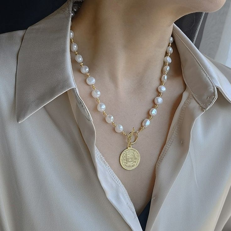 Experience the timeless beauty and elegance of our Baroque natural freshwater pearl necklace. Handcrafted from the finest pearls, each necklace is unique, with its own one-of-a-kind shape and luster. Add a touch of sophistication to any outfit with this luxurious and versatile piece.

Natural freshwater pearl
Pearl diameter:6mm
Pendant diameter:2.2cm
Weight about: 63g
Chain length: 40 CM (+ 5 cm adjustable chain)
Adjustable lobster clasp size - one size fits all
High quality zinc alloy
Hypoaller Luxury Adjustable Baroque Pearl Necklaces, Elegant Gold Beaded Baroque Pearl Necklaces, Luxury Formal Baroque Pearl Necklace, Elegant High Luster Baroque Pearl Necklace, Luxury Elegant Baroque Pearl Necklace, Freshwater Pearl Necklace, Freshwater Pearl Necklaces, Chain Lengths, Chain Length