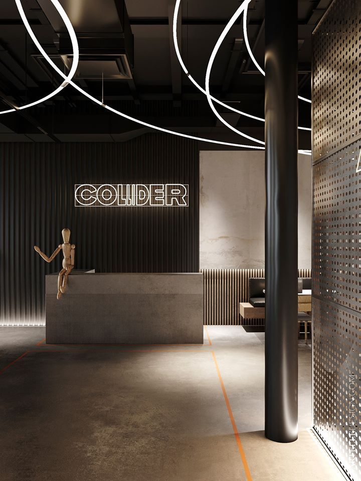 an empty room with a counter and some lights on the ceiling, along with a sign that reads'collider '