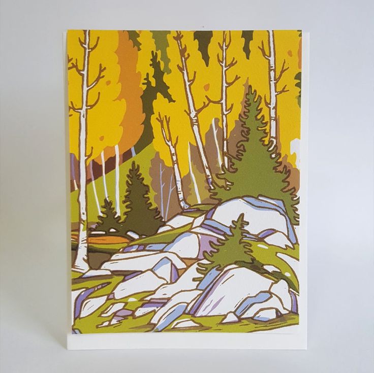 a card with trees and rocks in the background