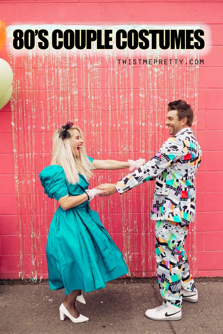 a man and woman dancing in front of a pink wall