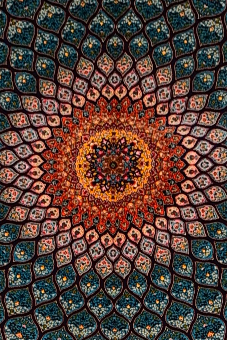 an intricate design is shown in the middle of this image, with many colors and shapes