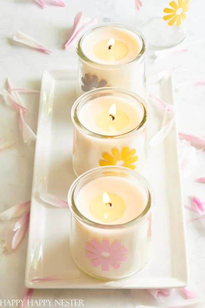 three candles sitting on top of a white plate