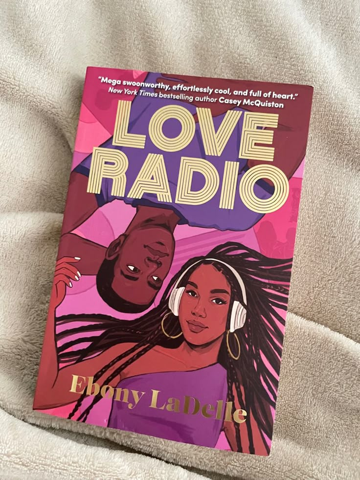 the book love radio is laying on a bed