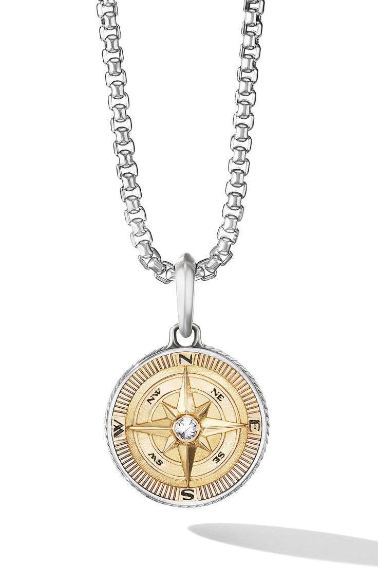 18-karat gold and sterling silver. Center diamond, total diamond weight: 0.07ct. Amulet, 29 x 20mm. Chain sold separately. Imported. >Diamond Guide Luxury Brilliant Cut Medallion Jewelry, Luxury Medallion-shaped Jewelry With Brilliant Cut, Fine Jewelry Diamond With Engraved Details, Fine Jewelry Diamond Engraved, Engraved Diamond Fine Jewelry, Fine Jewelry Engraved Diamond, Luxury Sterling Silver Compass Design Jewelry, Luxury Sterling Silver Jewelry With Compass Design, Silver Diamond Medallion Jewelry