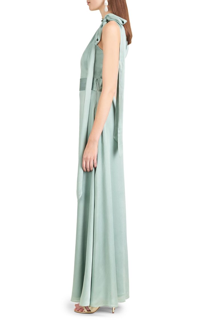 A satin tie at the neck and a pleated waist elevate the elegance of a flowy formal gown you'll feel gorgeous in at your next event. 57" center front length (size 8) Hidden side-zip closure Ties at neck Halter neck Sleeveless, with cutaway shoulders Lined 100% polyester Dry clean Imported Asian Owned/Founded Pre-draped Evening Dress With Tie Back, Pre-draped Silk Evening Dress With Pleated Back, Flowy Silk Pre-draped Maxi Dress, Elegant Full Length Gown With Pleated Bodice, Formal Pre-draped Maxi Dress With Pleated Back, Formal Pre-draped Gown With Pleated Back, Pre-draped Silk Gown With Pleated Bodice, Satin Maxi Dress With Pleated Back For Evening, Silk Pre-draped Dress With Pleated Back