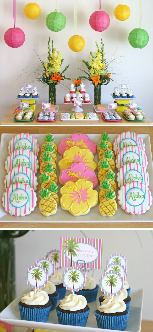 the dessert table is decorated with pineapples and cupcakes