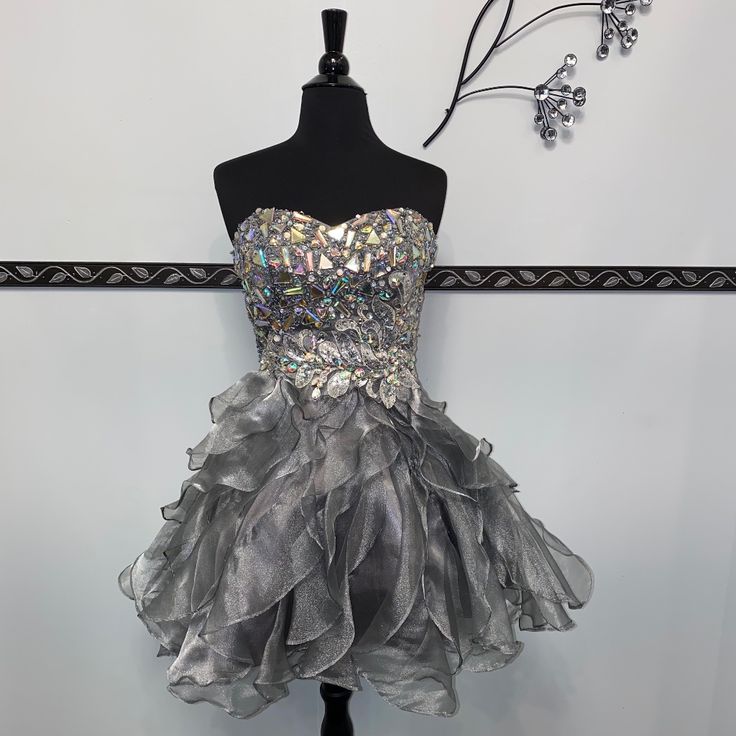 This Short Dress Features A Beautiful Jeweled Bodice, Cute Ruffle Skirt, With Side Zipper Closure. Clearance Style, As Is. Hoco Dresses Silver, Unique Hoco Dresses Short, Unique Hoco Dresses, Hi Low Gown, Short Ruffle Dress, Halter Homecoming Dress, Hot Pink Prom Dress, Sparkle Prom Dress, Hoco Dresses Short