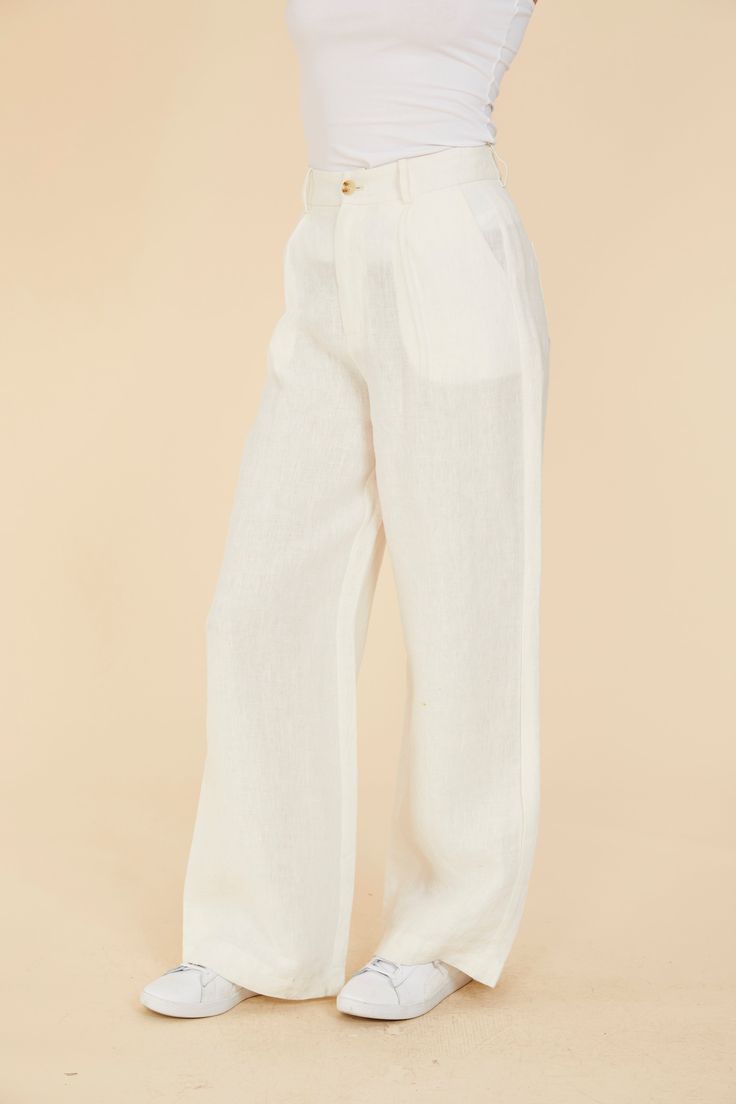 Indulge in breezy comfort with our Linen Wide Leg Pants. Lightweight and comfortable, these pants are the epitome of easygoing style. Their breathability makes them the perfect choice for spring, ensuring you stay cool while exuding effortless elegance. The wide leg adds to the casual vibe, making these pants a versatile and comfortable wardrobe staple for the season. Embrace the airy feel with every step in these spring-ready wide leg linen pants. Linen Wide leg Comes in White and Linen Match w Effortless Relaxed Fit Straight Leg Pants, Effortless White Bottoms For Spring, Effortless White Spring Bottoms, Relaxed Trousers With Pockets, Linen Tapered Leg Pants For Day Out, Effortless Wide-leg Spring Pants, Effortless Wide-leg Pants For Spring, Effortless Pants With Loosely Fitted Hips And Tapered Leg, Relaxed White Wide Leg Bottoms