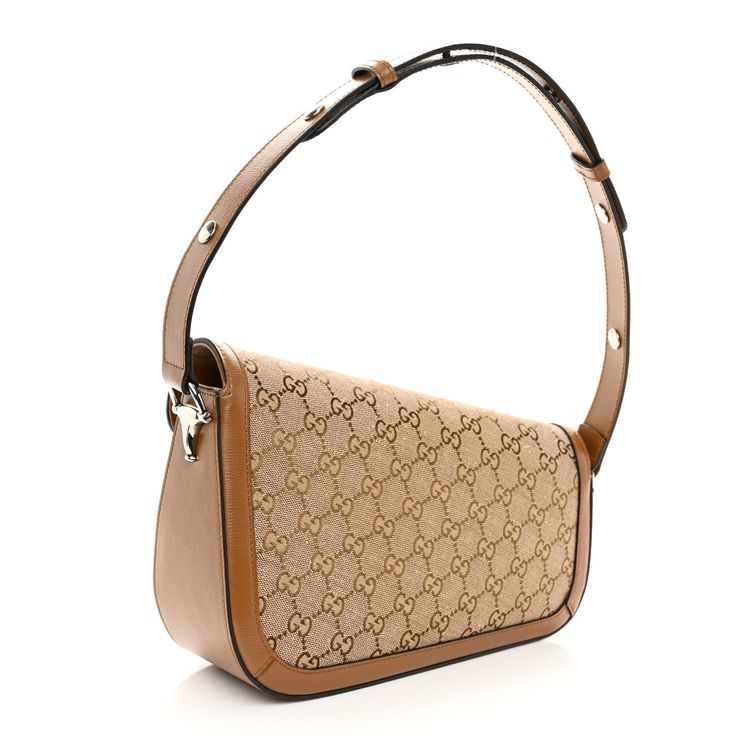 This is an authentic GUCCI Monogram Small Horsebit 1955 Asymmetric Shoulder Bag. This stylish shoulder bag is crafted of Gucci GG monogram fabric. The bag features a front flap with a silver horse-bit detail, and adjustable leather handle. The bag opens to a beige fabric interior with a zipper pocket. Gg Marmont Mini Bag, Gg Marmont Mini, Gucci Clutch, Gucci Crossbody Bag, Gucci Crossbody, Silver Horse, Gg Monogram, Gucci Monogram, Horse Bits