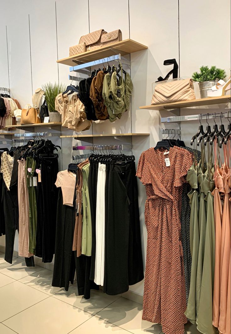 clothes and hats are on display in a clothing store