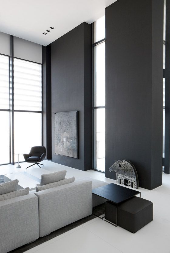 a modern living room with black and white decor