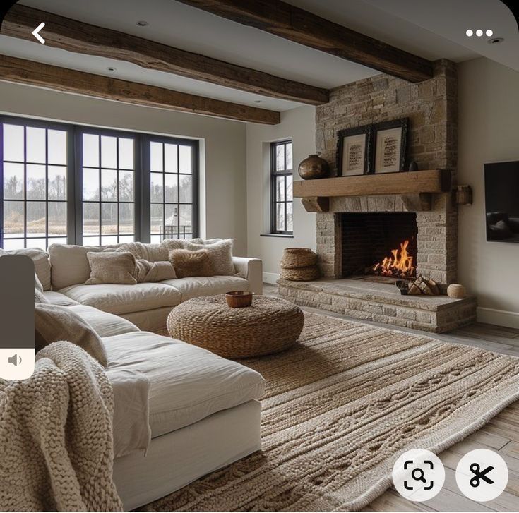 a living room with couches and a fire place in the middle of the room