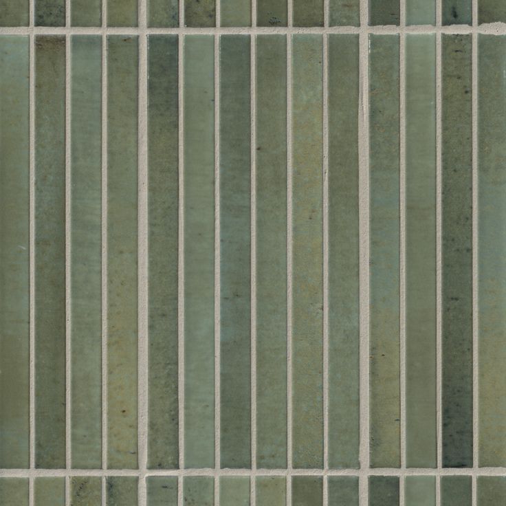 a green and white striped tile wallpaper with vertical lines on the bottom half of it