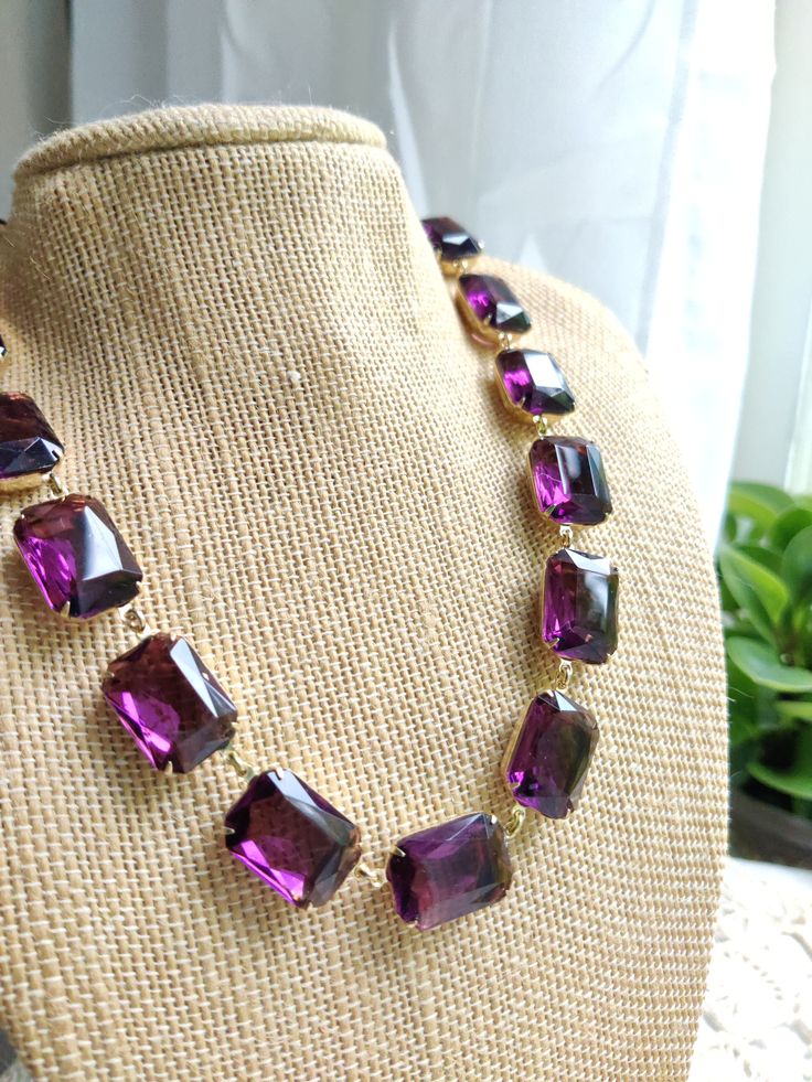 "This is a truly gorgeous collet style necklace with lovely vintage rhinestones. Each stone is hand polished. Striking purple amethyst glass crystals encircle your neck in the color of violet flowers. Everything is Hand made in my studio here at Sacred Cake. It's 17\" long with a 2\" extender. Each stone is 18mm. Please also see ruler and coin photo for size references. Arrives gift boxed for a completely decadent buying experience. Purple Kamala Harris necklace! The Unity of red and blue.❤️ LAY Purple Statement Necklace, Coin Photo, J Crew Style, Anna Wintour, Violet Flower, Amethyst Purple, Style Necklace, Vintage Rhinestone, Beautiful Packaging