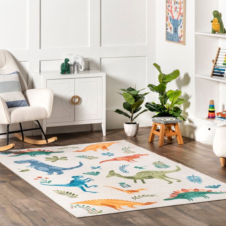 a child's room with white walls and wooden floors