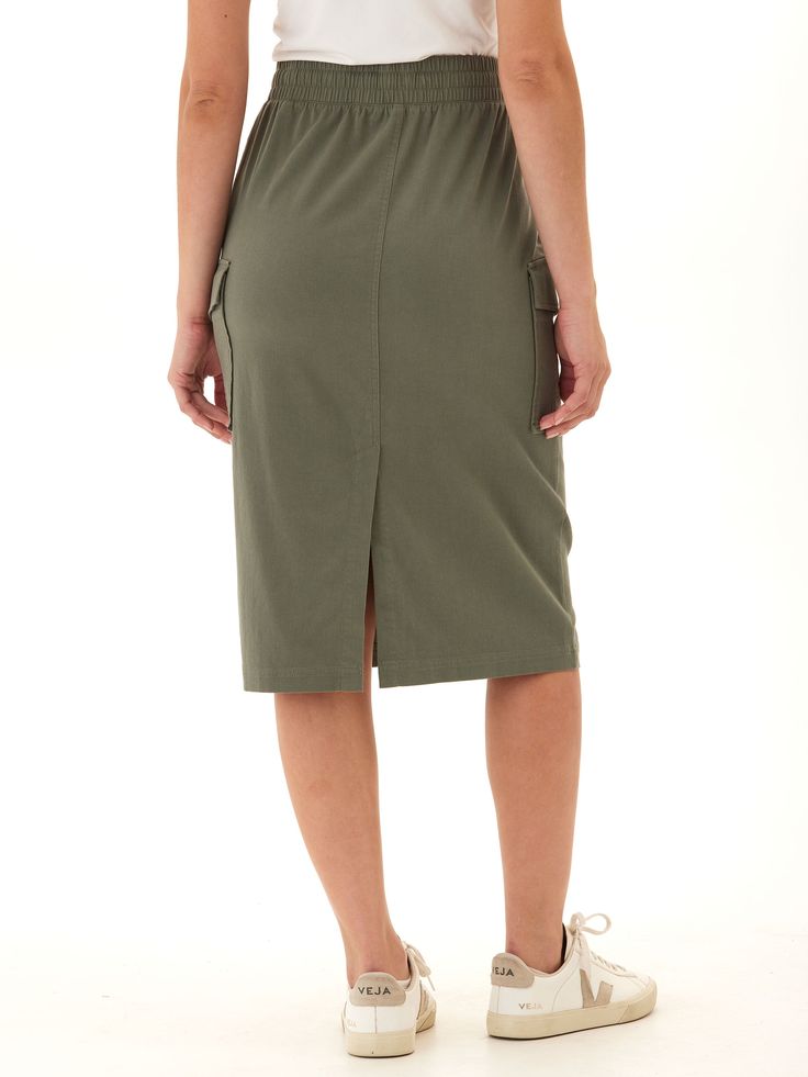 Experience ultimate comfort and style with the Wynne Stretch Twill Cargo Midi Skirt. Its stretchy fabric and flattering fit provide all-day wearability, while the thick elastic waistband offers a secure fit. Casual Stretch Pencil Skirt, Casual Fitted Cargo Skirt With Elastic Waistband, Casual Fitted Skirt With Elastic Waistband, Fitted Casual Skirt With Elastic Waistband, Versatile Skirt With Stretch And Pockets, Spring Skirt With Pockets And Elastane, Spring Skirt With Pockets, Stretch Cotton Skirt With Pockets, Stretch Elastane Skirt With Pockets