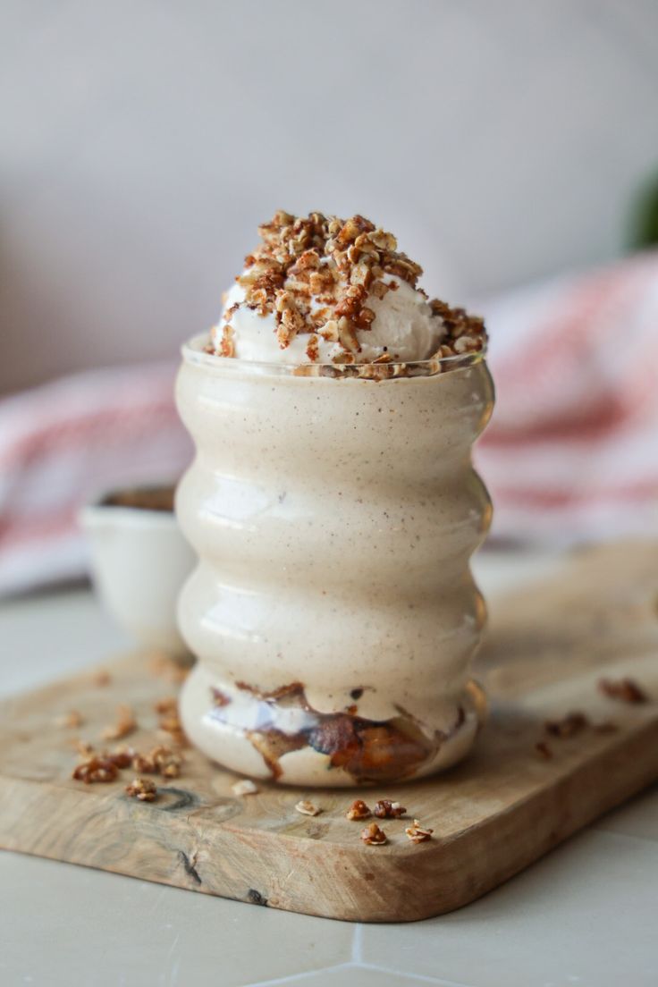 an ice cream sundae on a wooden board