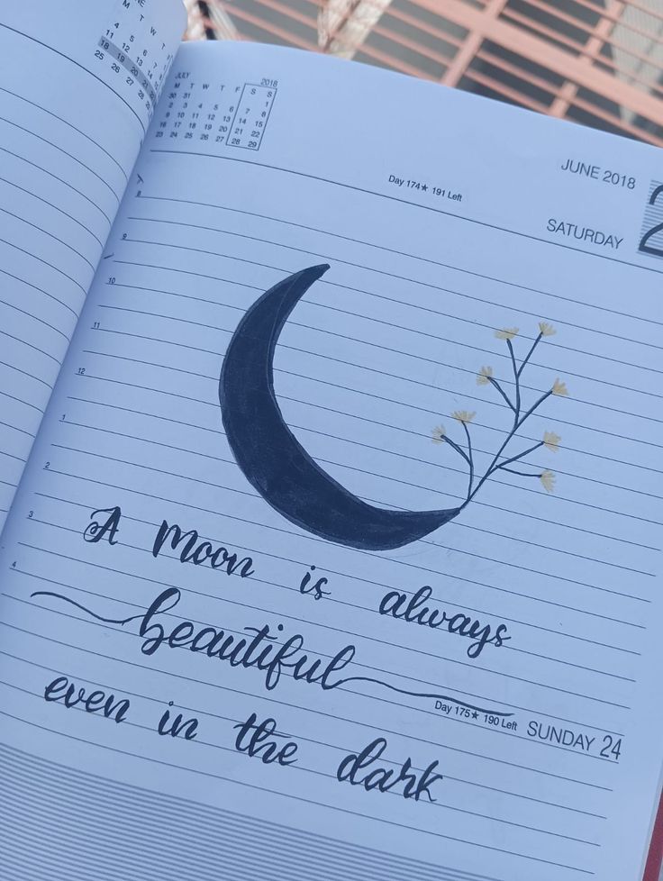 an open notebook with writing on it and the moon is always beautiful even in the dark