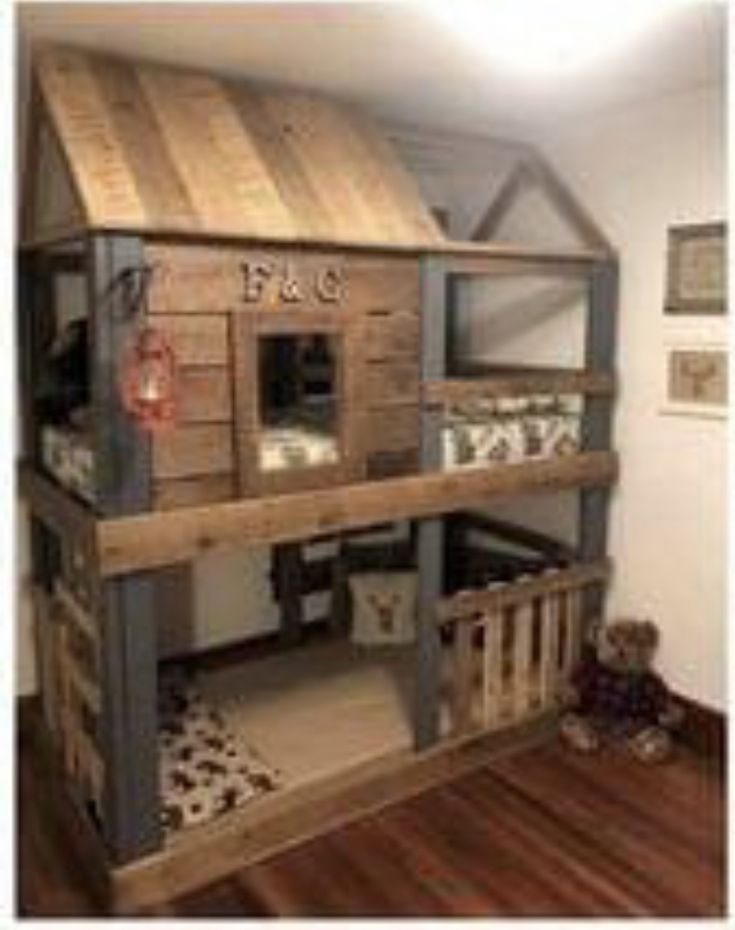 a wooden bunk bed sitting on top of a hard wood floor next to a teddy bear