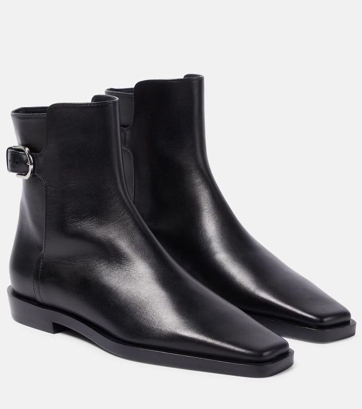 The Belted leather ankle boots in black - Toteme | Mytheresa Square Toe Chelsea Boots In Calf Leather For Work, Classic Square Toe Chelsea Boots In Calf Leather, Square Toe Calf Leather Chelsea Boots For Work, Classic Chelsea Boots With Square Toe In Calf Leather, Modern Calf Leather Boots For Business, Elegant Square Toe Chelsea Boots For Workwear, Elegant Square Toe Chelsea Boots For Work, Designer Calf Leather Heeled Boots With Square Toe, Leather Square Toe Chelsea Boots