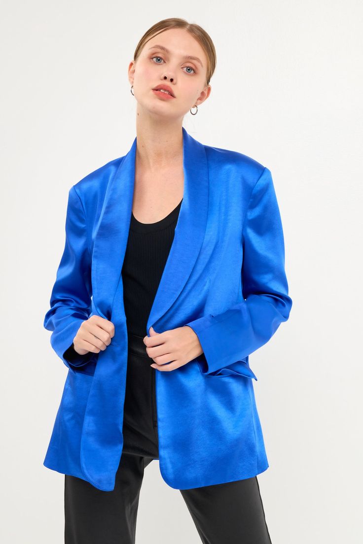 Elevate your style and step up your game with this blazer. With its sleek and shiny satin finish, this blazer is perfect for making a statement. It features a shawl collar, single button closure and welt pockets with flap. Plus, it's machine-washable so you can keep it looking fresh all year long. Whether you're dressing up for a formal event or just want to add a touch of sophistication to your everyday look, this blazer is the perfect choice. Shawl collar Single button closure Welt pockets wit Tailored Satin Tuxedo Outerwear, Tailored Satin Tuxedo Style Outerwear, Formal Satin Tuxedo-style Outerwear, Classic Satin Blazer For Party, Formal Spring Blazer With Shawl Collar, Formal Shawl Collar Blazer For Spring, Party Tuxedo Style Satin Outerwear, Party Satin Tuxedo Outerwear, Chic Single-button Silk Blazer