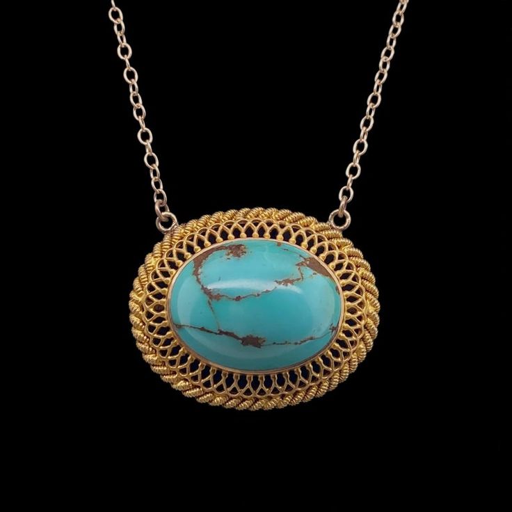 This is part of Chairish’s Fine Jewelry assortment.  A fine repurposed Victorian period 14K gold pendant with a natural polished turquoise in the center.  The bezel set stone is surrounded by a gold filigree frame.  The chain is marked 14K and is the adjustable type which allows you to wear it two inches shorter.  Condition is excellent.  The back of the pendant also has an applied small plaque stamped 14K.  It dates c. 1890.  Dimensions: 18" or 16", Pendant: Width: 1", Length: 3/4", Weight:  5. Gold Oval Turquoise Gemstone Necklace, Elegant Gold Turquoise Necklace With Oval Pendant, Elegant Yellow Gold Turquoise Necklace With Cabochon, Elegant Yellow Gold Turquoise Cabochon Necklace, Elegant Oval Turquoise Necklace With Large Pendant, Victorian Turquoise Filigree Jewelry, Gold Turquoise Pendant Necklace With Cabochon, Heirloom Turquoise Necklace As Gift, Heirloom Turquoise Necklace For Gift