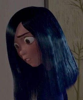 an animated woman with long black hair and big eyes looks at the camera while standing in front of a wall