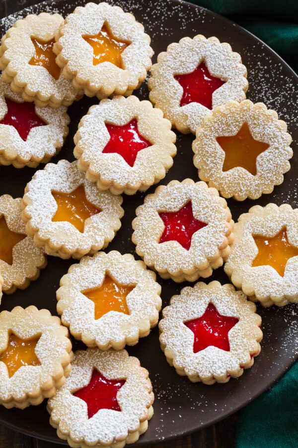 small cookies with jelly filling on a plate