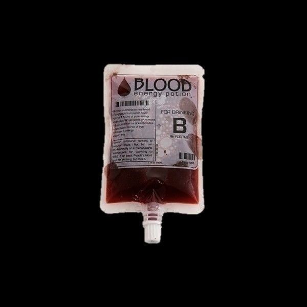 blood bag filled with red liquid against a black background