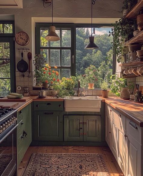 a kitchen filled with lots of green cupboards and counter top space next to a window