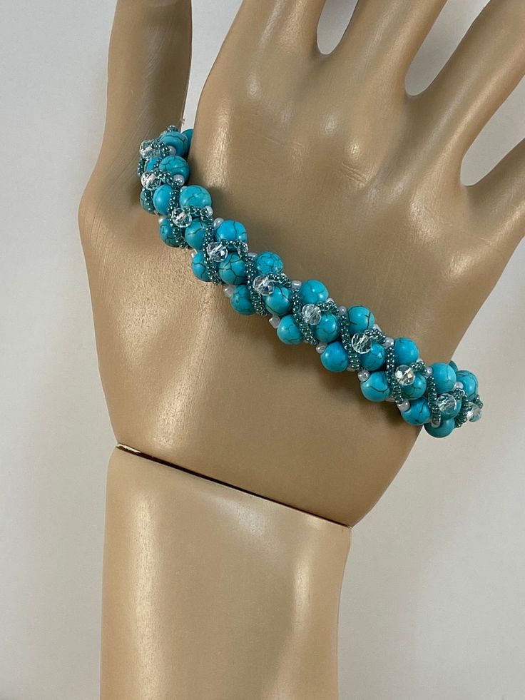 Turquoise Beaded bracelet designed by Allie Buchamn of Potomac Beads. Beaded Turquoise Crystal Bracelet As Gift, Turquoise Beaded Bangle Bracelet Gift, Bohemian Turquoise Pearl Bracelet With Round Beads, Turquoise Beaded Bangle Bracelet For Gift, Turquoise Bangle Beaded Bracelet For Gift, Bohemian Turquoise Crystal Bracelet With Spacer Beads, Turquoise Crystal Bracelet With Colorful Beads, Turquoise Beaded Stretch Bracelet Gift, Adjustable Turquoise Crystal Bracelet Hand-strung